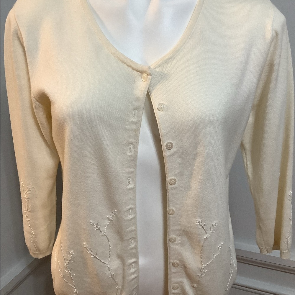 NOT FOR SALE.                CREAM CARDIGAN SWEATER WITH RAISED FLOWERS AND STEM